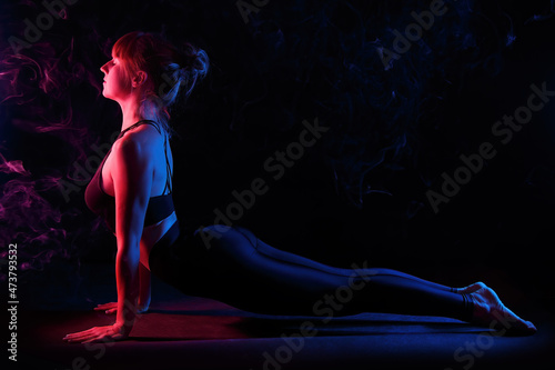 Tableau sur toile Woman does Urdhva Mukha Shvanasana - Upward Facing Dog yoga pose.