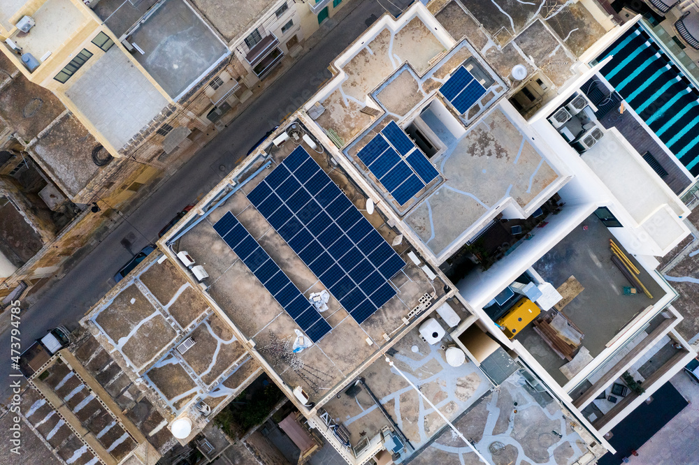 Malta, Northern Region, Mellieha, Aerial view of solar panels on rooftops of city houses Malta, Northern Region, Mellieha, Aerial view of solar panels on rooftops of city houses