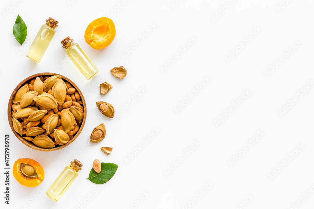Apricot kernel oil with ripe apricot fruits, top view Apricot kernel oil with ripe apricot fruits, top view