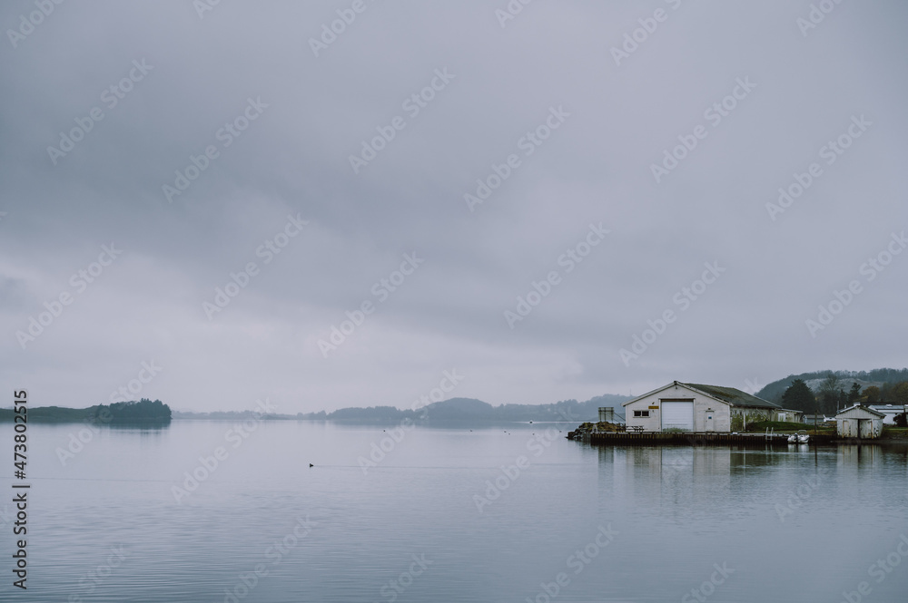 Scenic landscape of foggy fjord at cloudy day. Nature of Norway. Hafrsfjord, Stavanger. Scenic landscape of foggy fjord at cloudy day. Nature of Norway. Hafrsfjord, Stavanger.