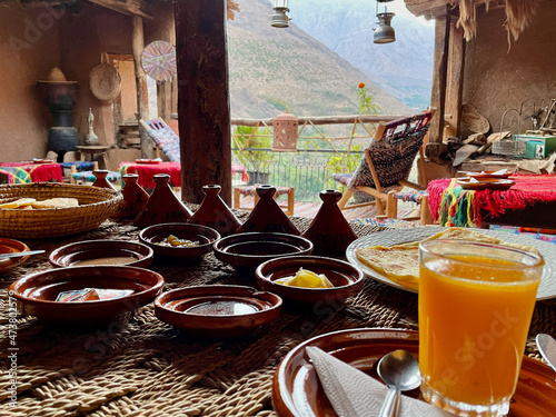 Delicious Moroccan breakfast on beautiful rooftop terrace in the High Atlas Mountains. Imlil, Morocco. photo