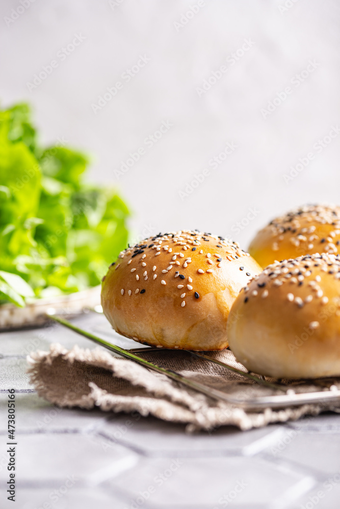 Freshly baked burger buns on a table