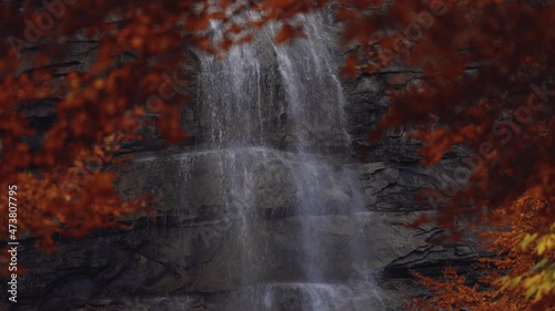 Morricana Waterfalls in Monti della Laga, Abruzzo, Italy, in the full autumn season with red and orange leaves, 4K footage photo