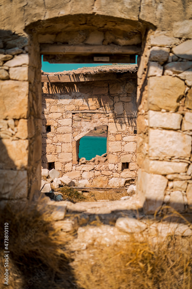 Old Abandoned Ruins of Foinikas Village in Cyprus, located on the green lake Old Abandoned Ruins of Foinikas Village in Cyprus, located on the green lake