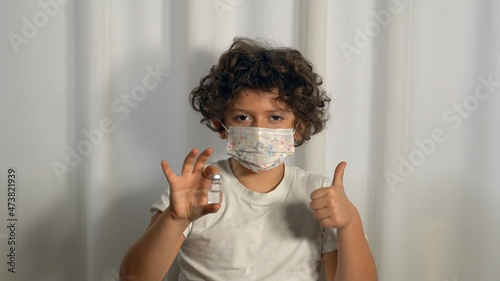 Europe, Italy, Milan - Vaccination against Covid-19 Coronavirus for children in pediatric age 5-11 years - pro vax and no vax with generic vaccine vial - Parental indecision on the vaccine on children photo