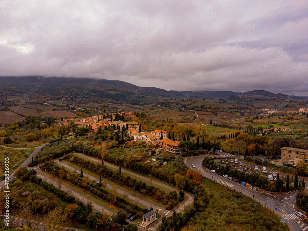 Typical landscape with small villages and farm fields in Tuscany - travel photography