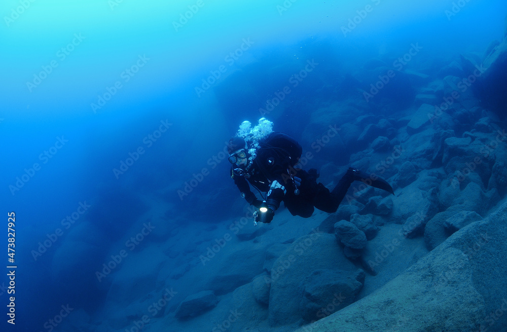 Scuba diver in deep freah water lake, Lake Tahoe, California, USA Scuba diver in deep freah water lake, Lake Tahoe, California, USA