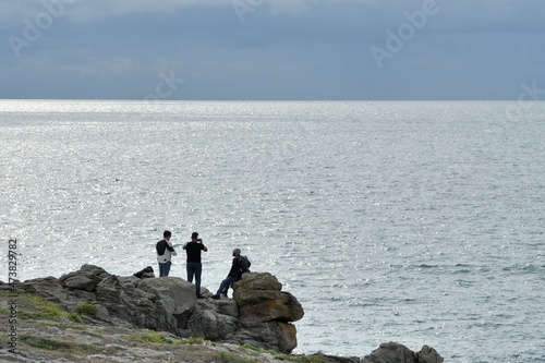 People watching the sea on the Quiberon peninsula coast in Brittany - France