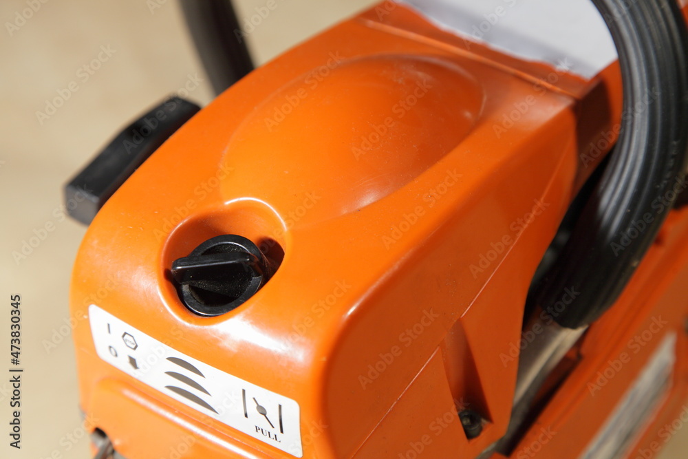 Chinese chainsaw motor cap hood close up closed view , garden power tools Chinese chainsaw motor cap hood close up closed view , garden power tools