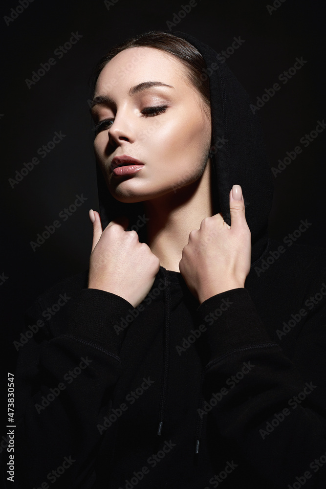 portrait of beautiful young woman in hood portrait of beautiful young woman in hood