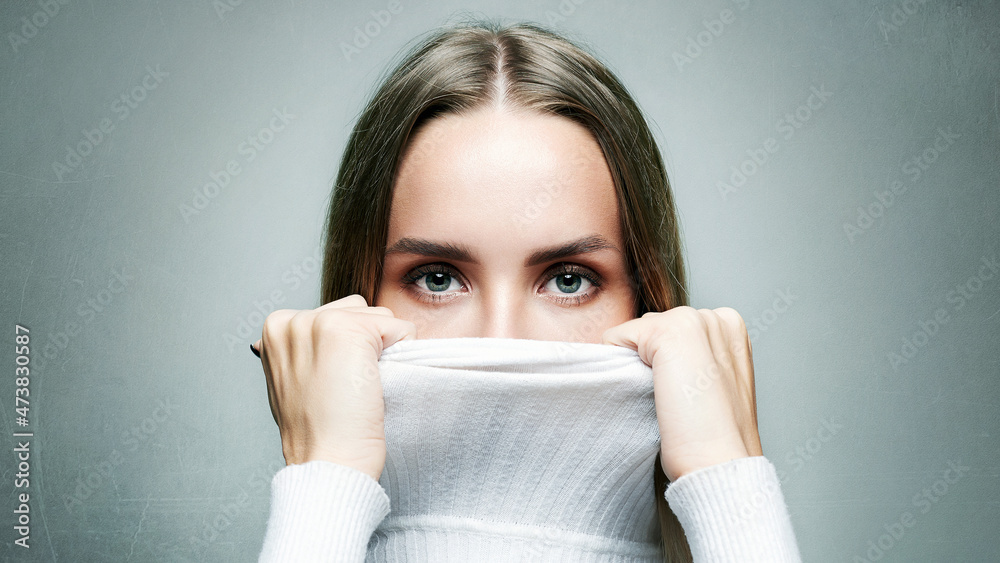 fashionable blonde girl in white wool turtleneck fashionable blonde girl in white wool turtleneck