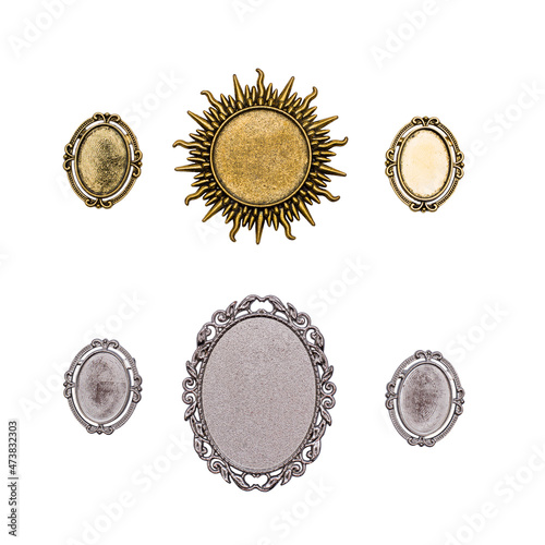 Gold and silver brooches isolated on a white background.