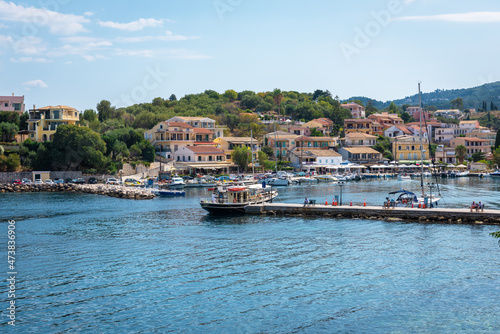 Fototapeta Naklejka Na Ścianę i Meble -  View of the port of Kassiopi on the island of Corfu (Greece) from the opposite shore of the bay