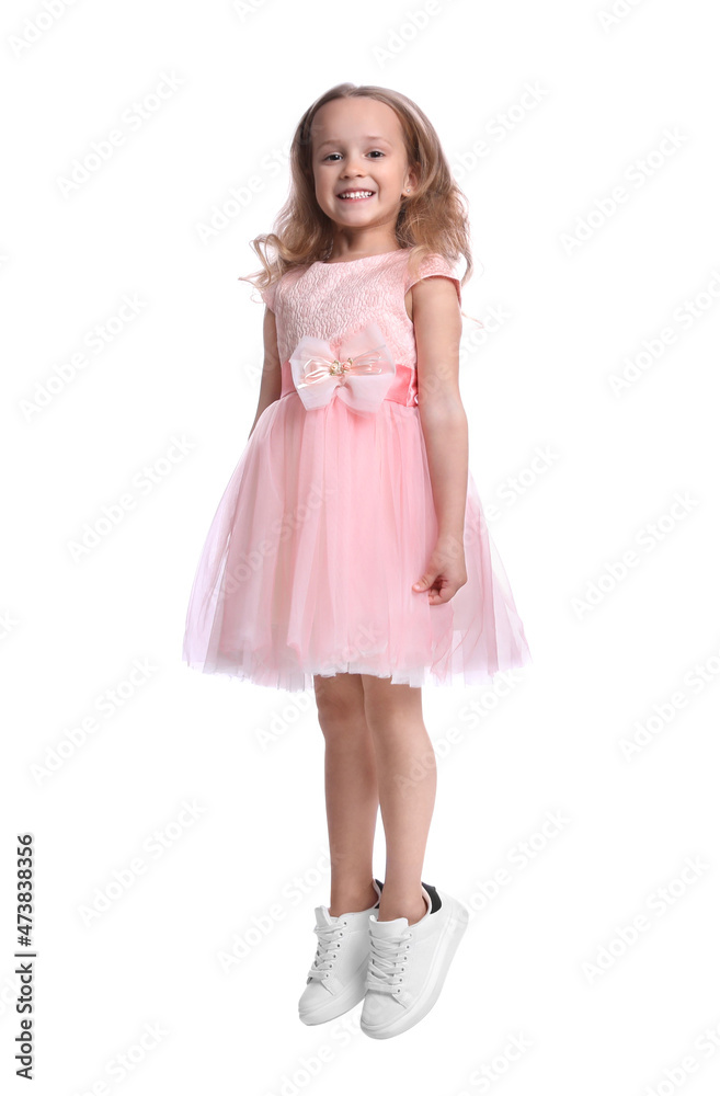 Cute little dancer in beautiful dress jumping on white background Cute little dancer in beautiful dress jumping on white background