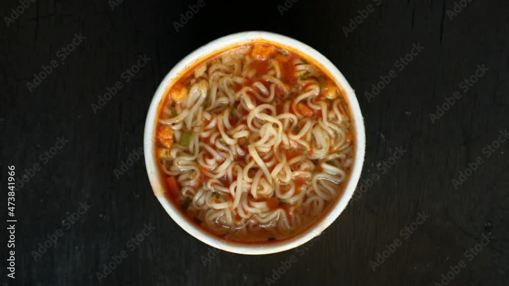 cup instant noodles on wooden background. Top view. High angle. Easy cooking. Delicious food. cup instant noodles on wooden background. Top view. High angle. Easy cooking. Delicious food.
