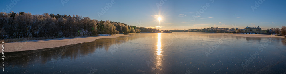 Sunny winter view over the Drottningholm icy bay a pale winter day in Stockholm Sunny winter view over the Drottningholm icy bay a pale winter day in Stockholm