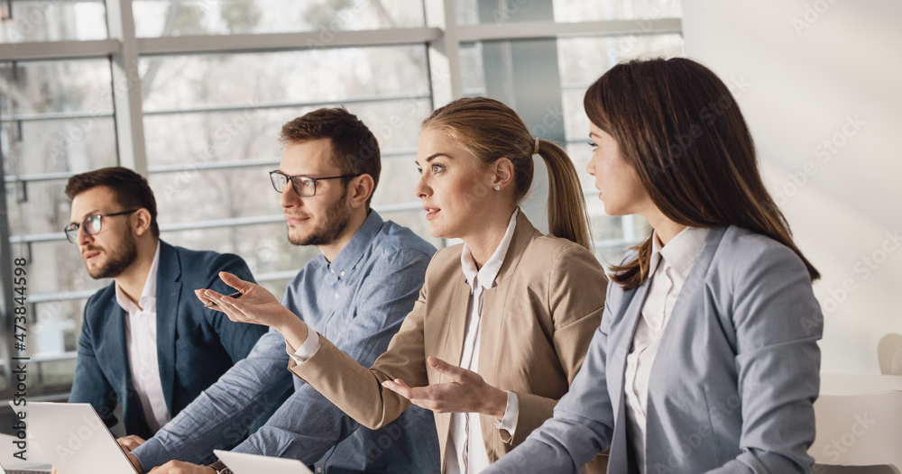 Obraz premium Group of business people at the conference.They listening presentation about business strategy and new projects.