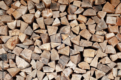 Pile of a dry chopped firewood logs
