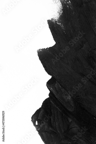Black brush strokes on white paper isolated. Black brush strokes oil paints on white paper. Isolated on white background. Abstract creative white black background