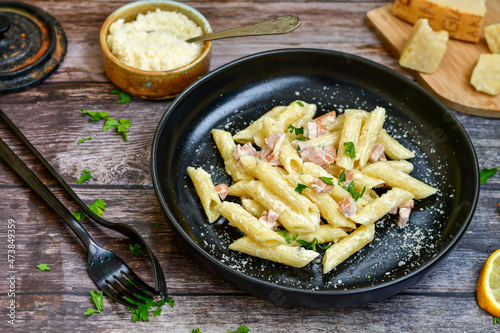  Fresh home made italian penne pasta alla carbonara with cream sauce , bacon,egg, parmesan cheese ,olive oil and black pepper) 