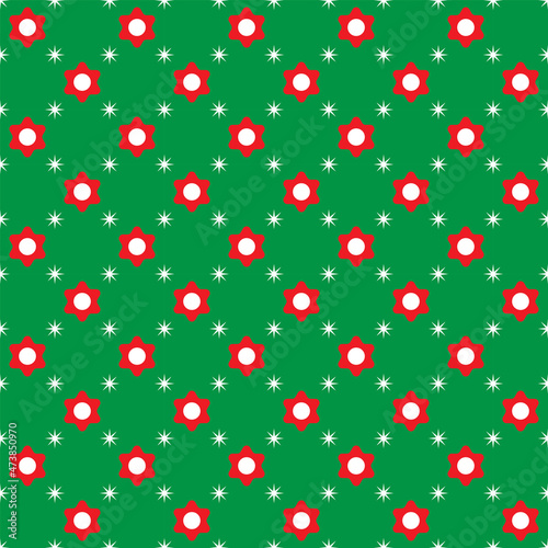 Red flowers and white dots on green background. Christmas color pattern. 