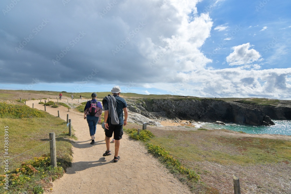 People,walking along the wild coast at the Quiberion peninsula in Brittany France