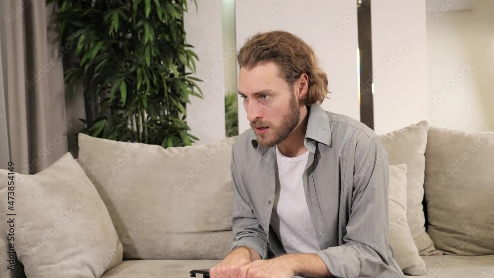Stressed business man feels frustrated by data loss using laptop at work. Shocked male user looks at computer reads bad news close screen, has unexpected online website problem sitting at home. Stressed business man feels frustrated by data loss using laptop at work. Shocked male user looks at computer reads bad news close screen, has unexpected online website problem sitting at home.