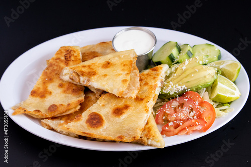 meat and cheese Quesadilla with a side salad