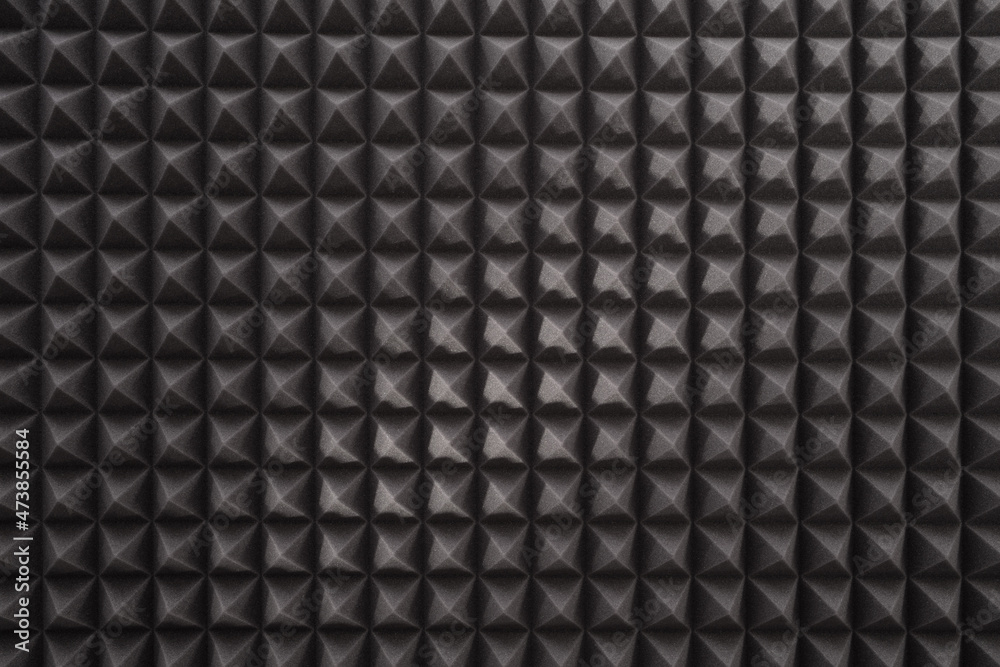 Triangular acoustic foam rubber. Sound proof pattern texture wall in sound studio. Background of sound absorbing sponge. Triangular acoustic foam rubber. Sound proof pattern texture wall in sound studio. Background of sound absorbing sponge.
