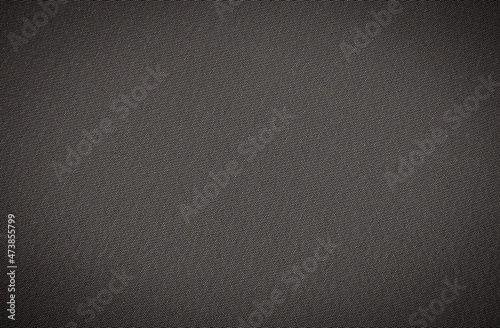 Background in gray material with vignetting. Dark shade fabric