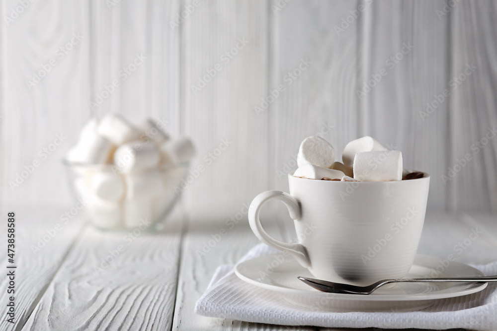 Mug with hot chocolate and marshmallows on wooden table Mug with hot chocolate and marshmallows on wooden table