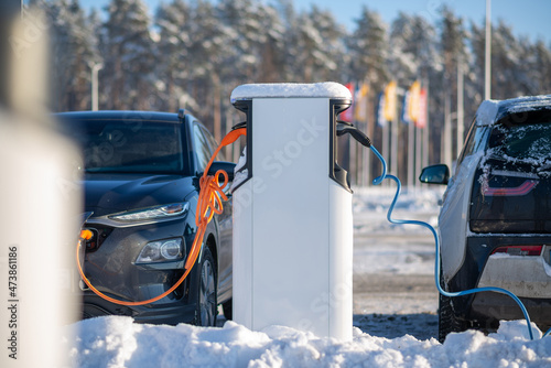 Electric car charging at a station