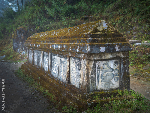 close up view to old stone tomb in village Phakding in Nepal photo