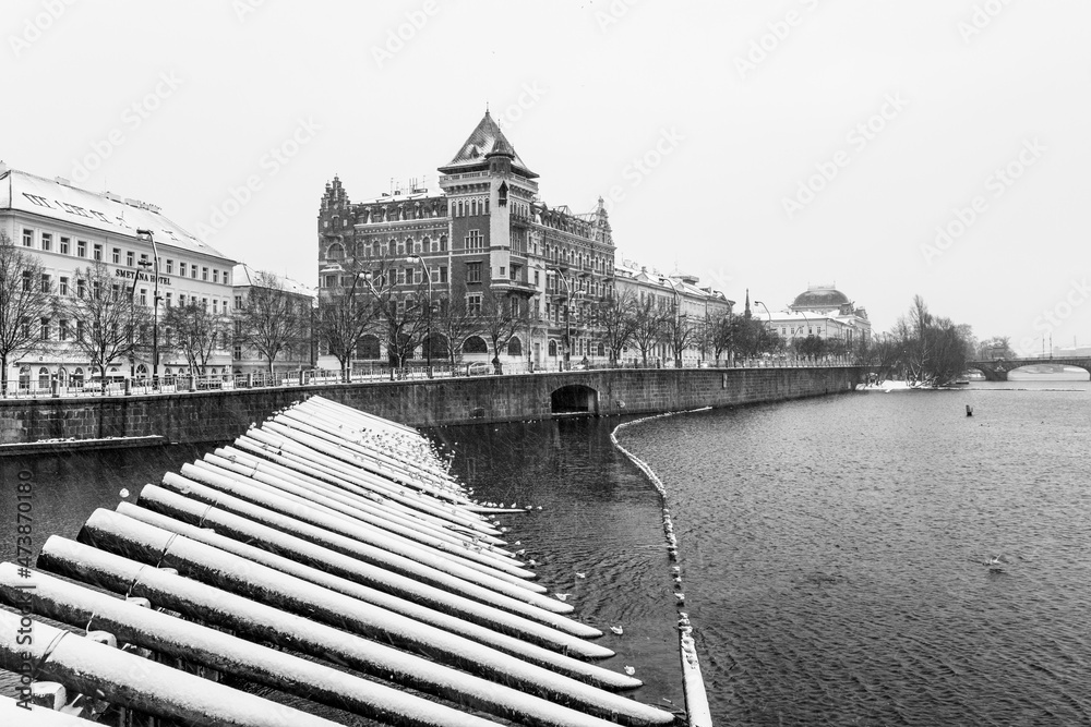 Snow on embankment in winter Prague