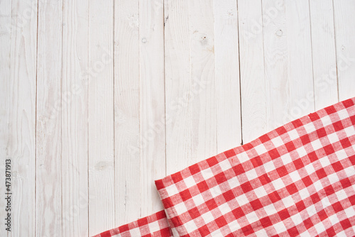 Red checkered tablecloth wooden background texture kitchen decoration