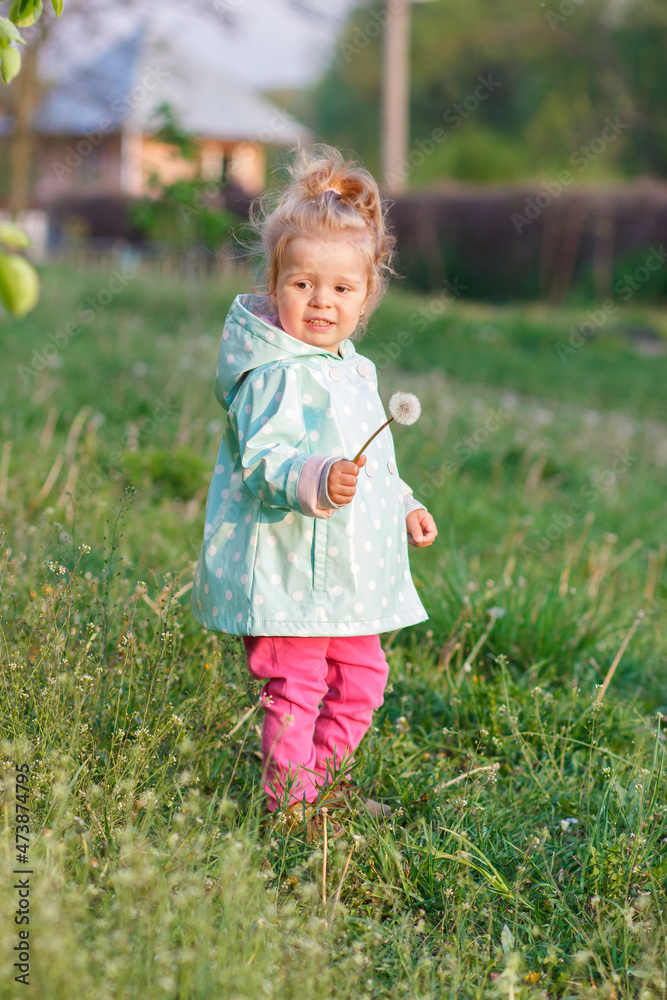 Little cute girl in the park, blurred background Little cute girl in the park, blurred background