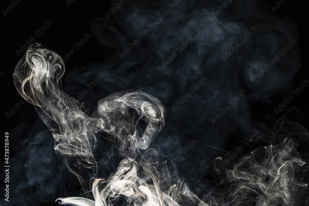 Smoke effect texture. Isolated background. Black and dark backdrop. Smokey fire and mistic effect. Smoke effect texture. Isolated background. Black and dark backdrop. Smokey fire and mistic effect.