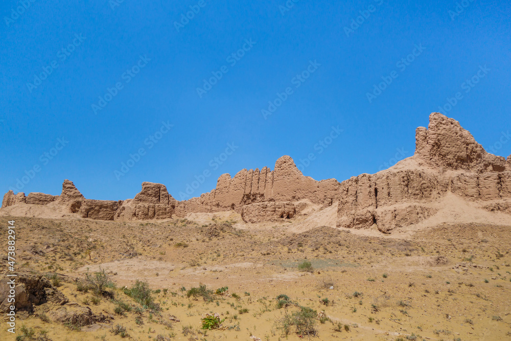 Panorama of the walls of the ancient fortress Ayaz-Kala (Windy fortress). Fortification was built in the 3-4th century BC. Height of the walls reaches 10 m. Shot in the Kyzyl Kum desert, Uzbekistan