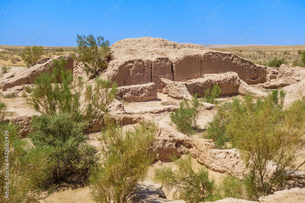 Panorama of residential buildings of Ayaz-Kala fortress, almost disappeared and covered with sands and plants of Kyzylkum desert. Built in 1-2 cent AD. Shot in Karakalpakstan, Uzbekistan