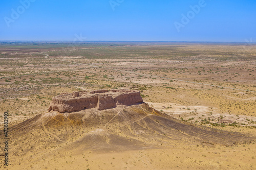 Panorama of fortress Ayaz-Kala 2 surrounded by Kyzyl Kum desert (Uzbekistan). Fortification was built in 6-8th century on hill 40m high photo