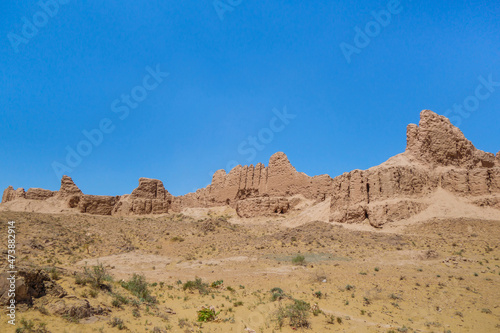 Panorama of the walls of the ancient fortress Ayaz-Kala (Windy fortress). Fortification was built in the 3-4th century BC. Height of the walls reaches 10 m. Shot in the Kyzyl Kum desert, Uzbekistan