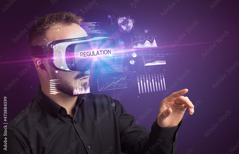 Businessman looking through Virtual Reality glasses Businessman looking through Virtual Reality glasses