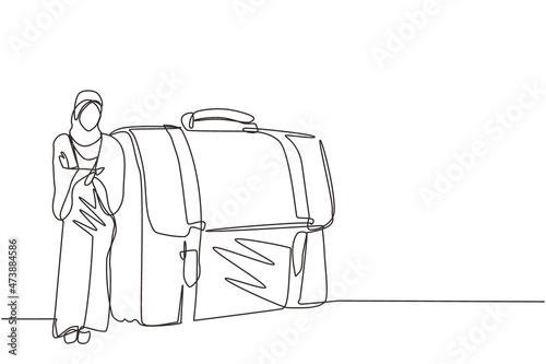 Single continuous line drawing modern confident female entrepreneur leaning on large briefcase. Arab businesswoman standing with elegance pose. Dynamic one line draw graphic design vector illustration