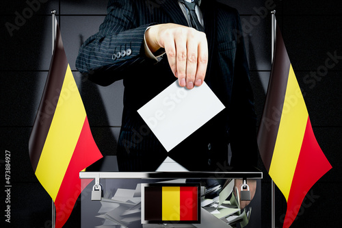 Belgium flags, hand dropping voting card - election concept - 3D illustration photo