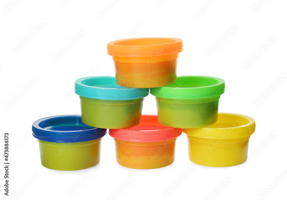 Plastic containers with colorful play dough on white background Plastic containers with colorful play dough on white background