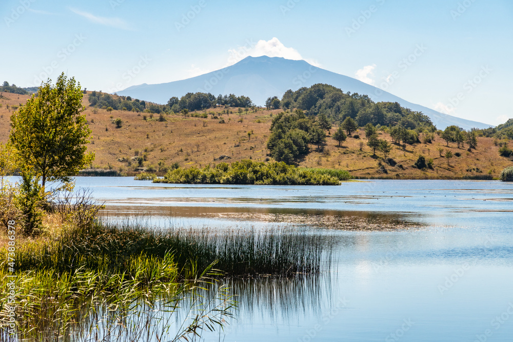 View of Biviere lake with Etna volcano, Nebrodi National Park, Sicily, Italy