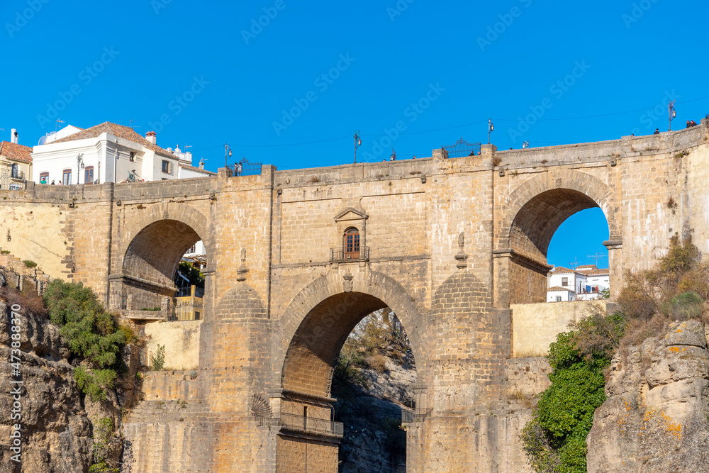 Panoramic view of the canyon, old town and bridge in the medieval city of Ronda, Spain, in the Southern Andalusia region.	