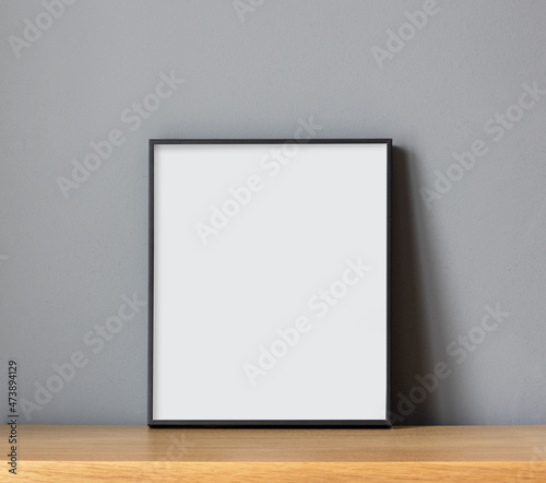 empty frame on wooden shelf