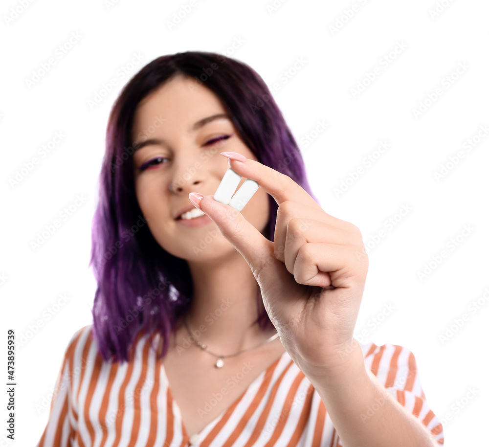 Young woman with chewing gums on white background Young woman with chewing gums on white background