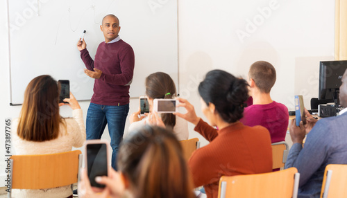 Teacher conducts a refresher course for employees
